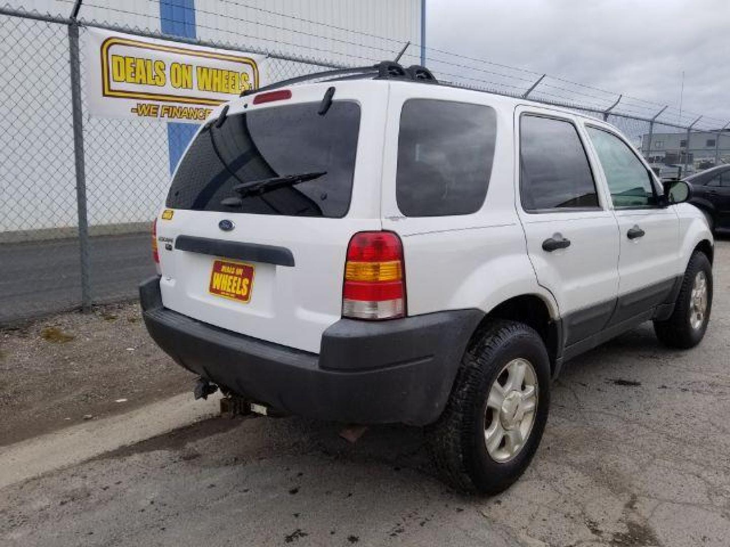 2004 Oxford White Ford Escape XLT 4WD (1FMYU93114D) with an 3.0L V6 DOHC 24V engine, 4-Speed Automatic transmission, located at 1821 N Montana Ave., Helena, MT, 59601, 0.000000, 0.000000 - Photo#4