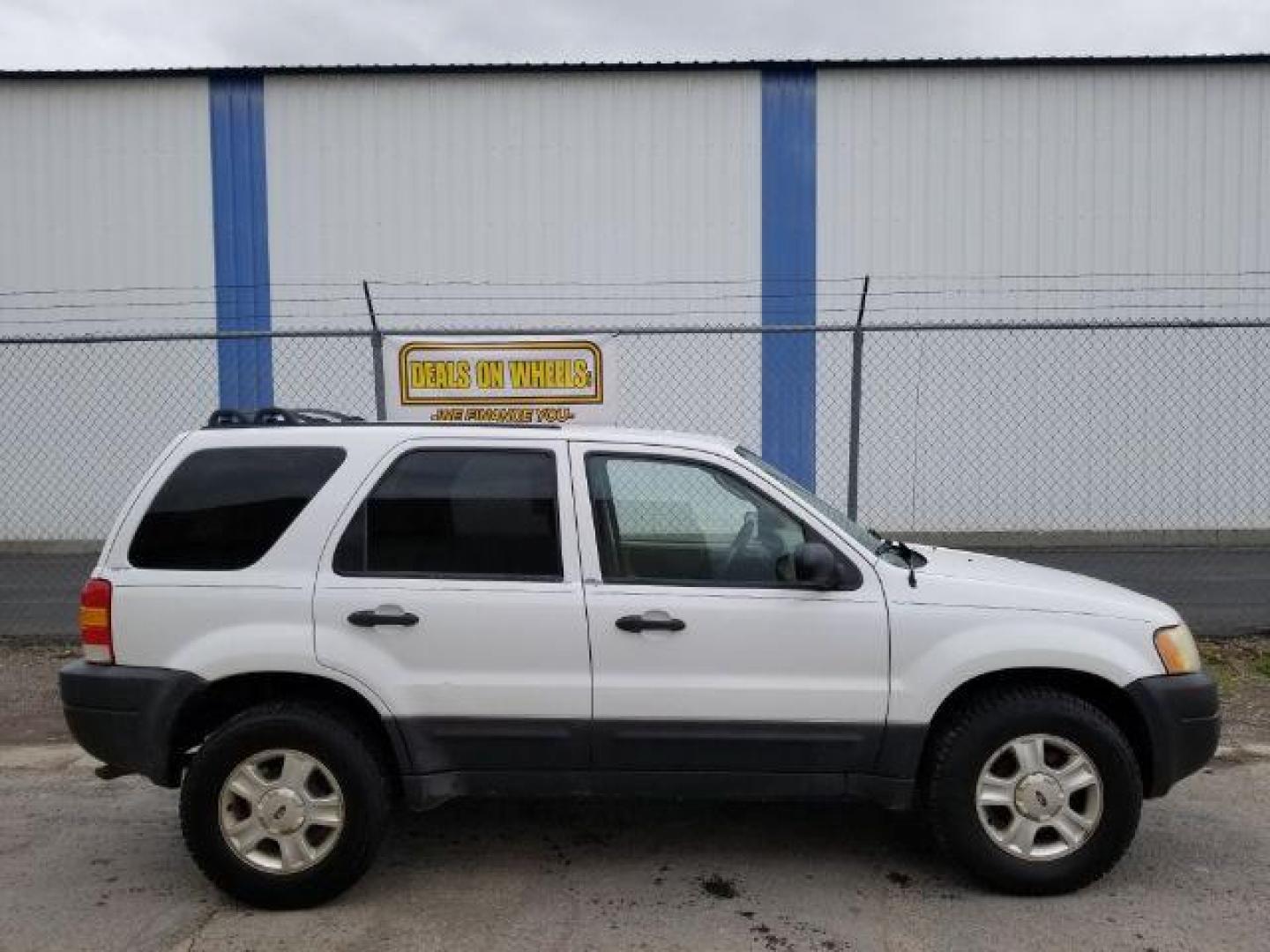 2004 Oxford White Ford Escape XLT 4WD (1FMYU93114D) with an 3.0L V6 DOHC 24V engine, 4-Speed Automatic transmission, located at 1821 N Montana Ave., Helena, MT, 59601, 0.000000, 0.000000 - Photo#5