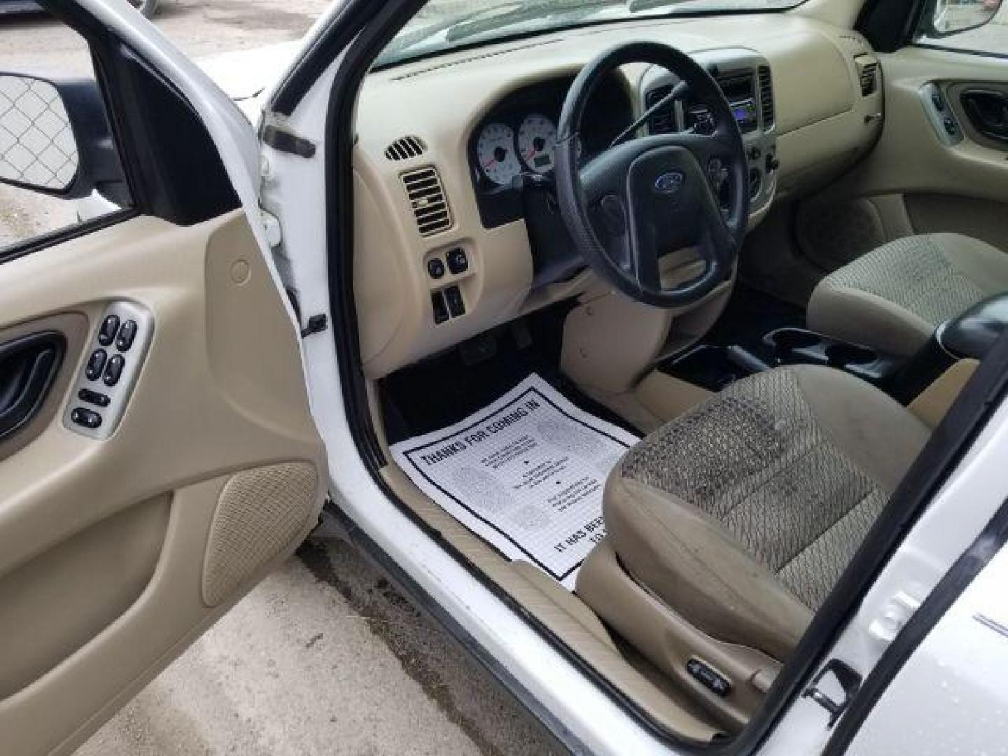 2004 Oxford White Ford Escape XLT 4WD (1FMYU93114D) with an 3.0L V6 DOHC 24V engine, 4-Speed Automatic transmission, located at 1821 N Montana Ave., Helena, MT, 59601, 0.000000, 0.000000 - Photo#7