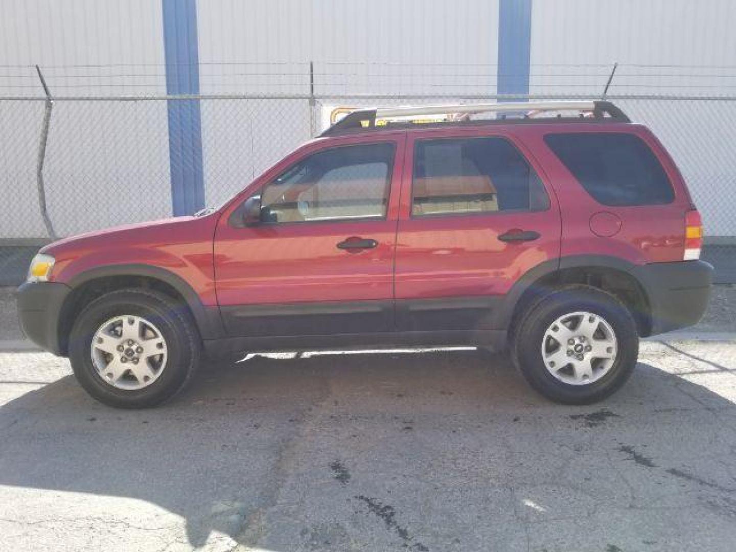 2005 Red Fire Metallic Ford Escape XLT 4WD (1FMYU93125K) with an 3.0L V6 DOHC 24V engine, 4-Speed Automatic transmission, located at 4801 10th Ave S,, Great Falls, MT, 59405, 0.000000, 0.000000 - Photo#2