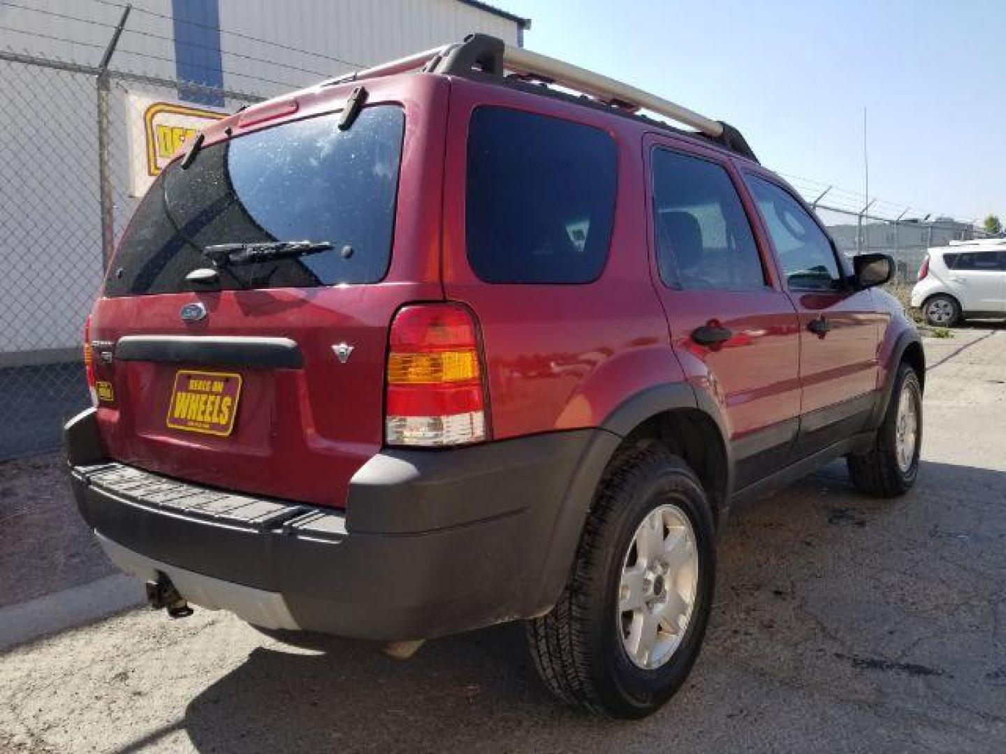 2005 Red Fire Metallic Ford Escape XLT 4WD (1FMYU93125K) with an 3.0L V6 DOHC 24V engine, 4-Speed Automatic transmission, located at 4801 10th Ave S,, Great Falls, MT, 59405, 0.000000, 0.000000 - Photo#4