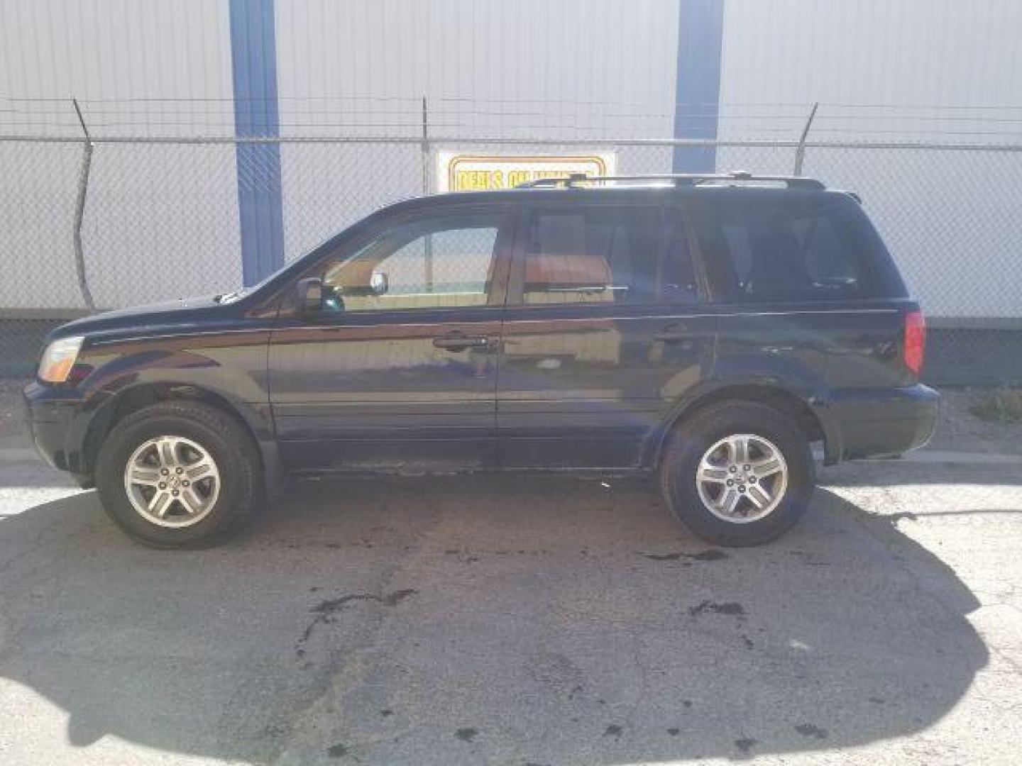 2005 Nighthawk Black Pearl Honda Pilot EX (2HKYF18425H) with an 3.5L V6 SOHC 24V engine, 5-Speed Automatic transmission, located at 1800 West Broadway, Missoula, 59808, (406) 543-1986, 46.881348, -114.023628 - Photo#2