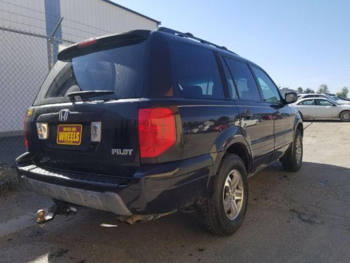 2005 Nighthawk Black Pearl Honda Pilot EX (2HKYF18425H) with an 3.5L V6 SOHC 24V engine, 5-Speed Automatic transmission, located at 1800 West Broadway, Missoula, 59808, (406) 543-1986, 46.881348, -114.023628 - Photo#4