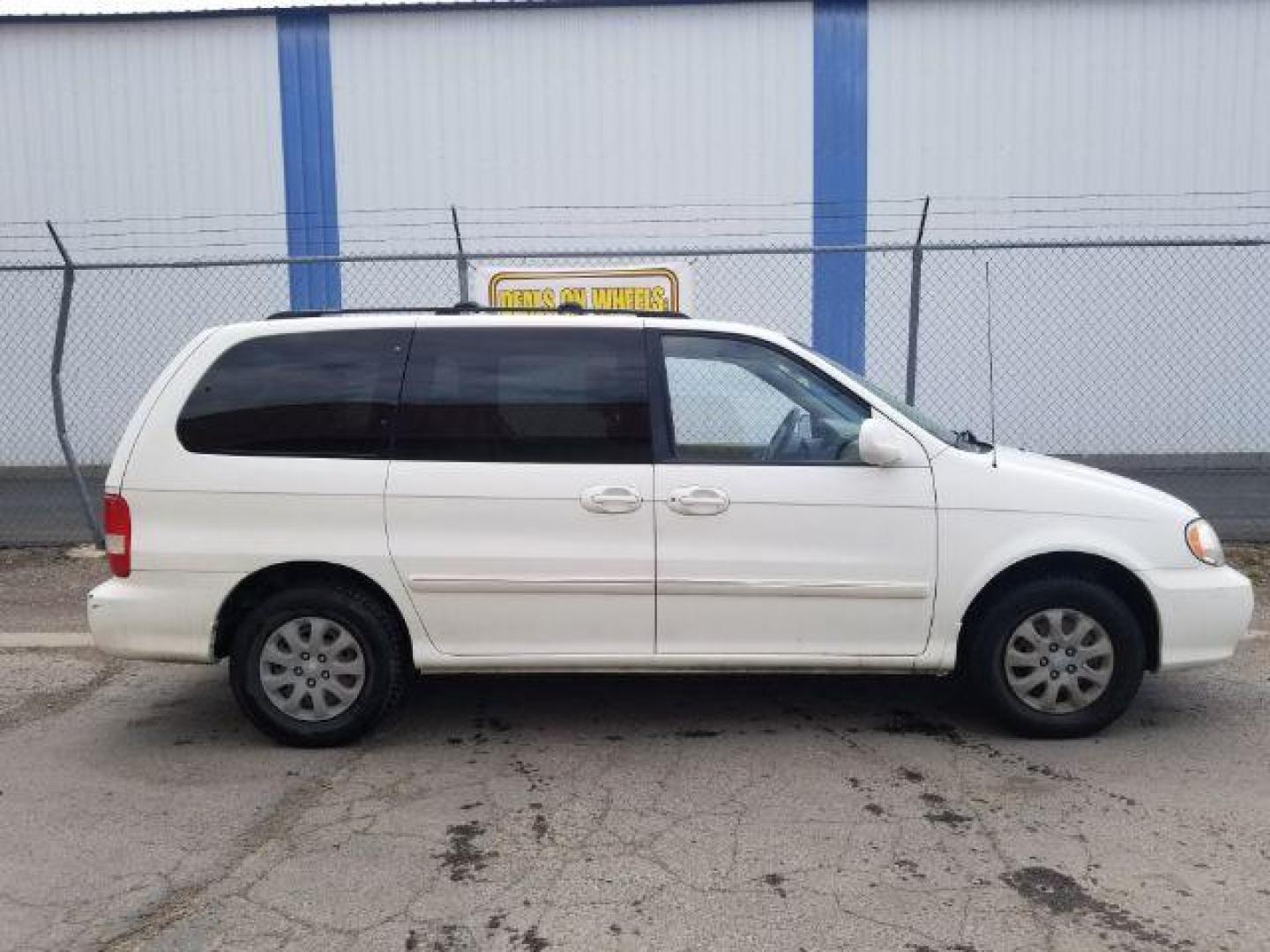 2005 Clear White /Beige Cloth Interior Kia Sedona LX (KNDUP132856) with an 3.5L V6 DOHC 16V engine, 5-Speed Automatic transmission, located at 4801 10th Ave S,, Great Falls, MT, 59405, 0.000000, 0.000000 - Photo#5