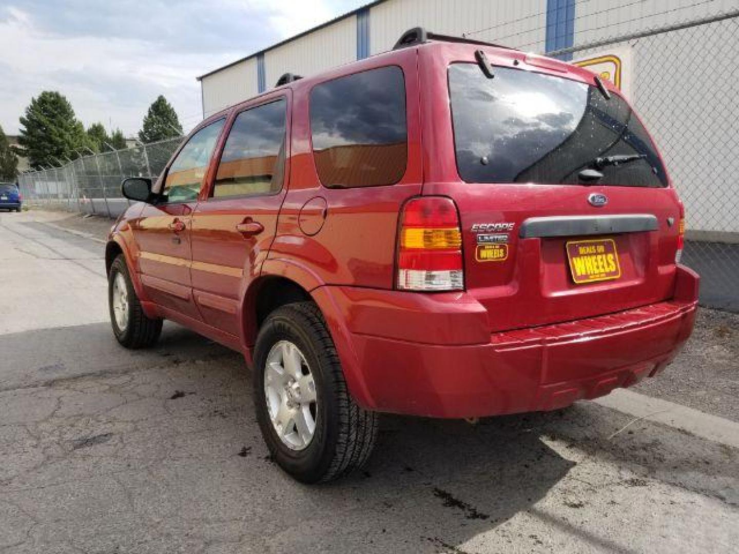 2007 Red Fire Metallic Ford Escape Limited 4WD (1FMYU94127K) with an 3.0L V6 DOHC 24V engine, 4-Speed Automatic transmission, located at 4801 10th Ave S,, Great Falls, MT, 59405, 0.000000, 0.000000 - Photo#2