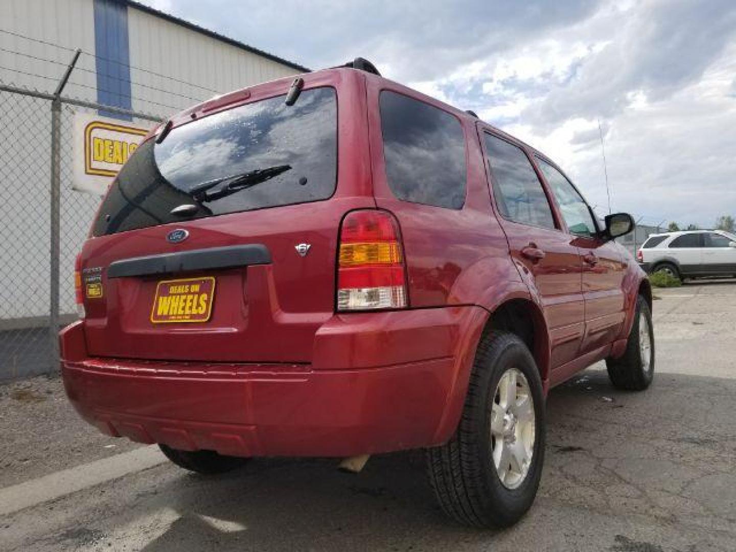 2007 Red Fire Metallic Ford Escape Limited 4WD (1FMYU94127K) with an 3.0L V6 DOHC 24V engine, 4-Speed Automatic transmission, located at 4801 10th Ave S,, Great Falls, MT, 59405, 0.000000, 0.000000 - Photo#4