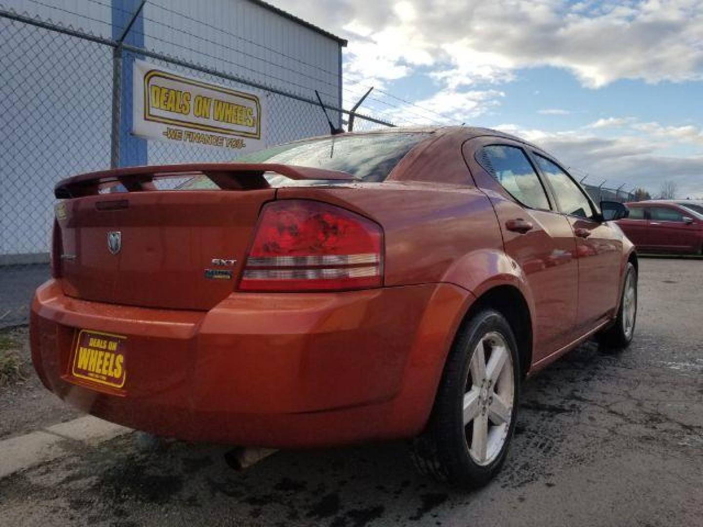 2008 Sunburst Orange Pear Dodge Avenger SXT (1B3LC56R08N) with an 2.7L V6 DOHC 24V FFV engine, 4-Speed Automatic transmission, located at 1800 West Broadway, Missoula, 59808, (406) 543-1986, 46.881348, -114.023628 - Photo#4