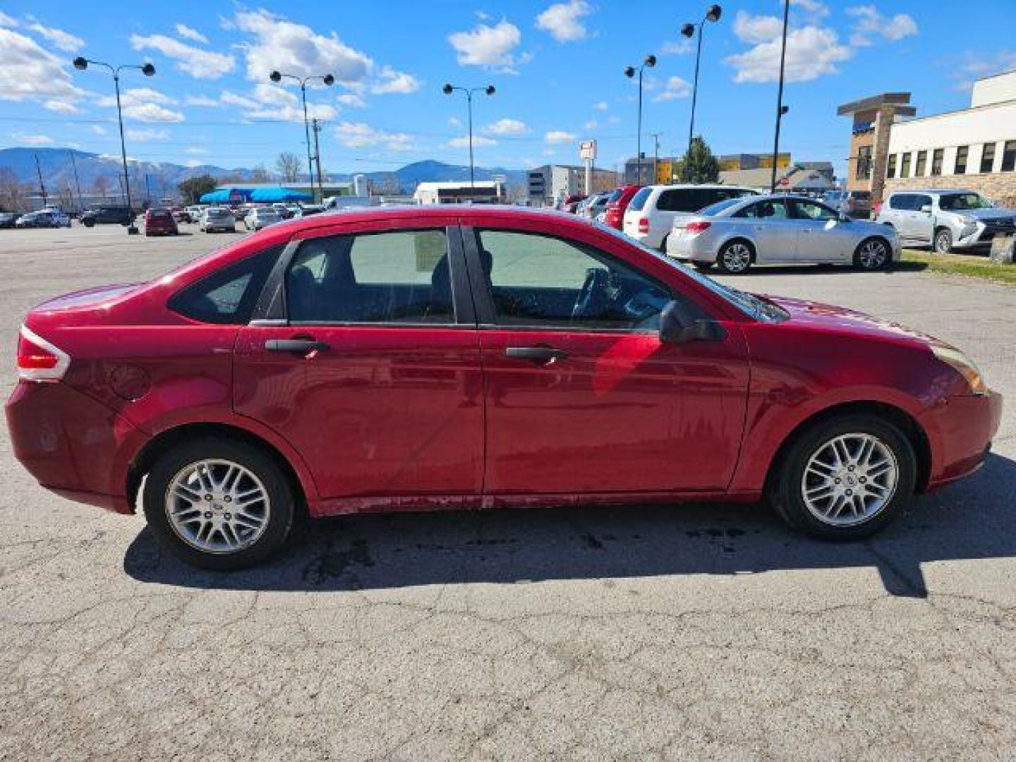 2009 Sangria Red Metallic /Medium Stone Cloth I Ford Focus SE Sedan (1FAHP35N59W) with an 2.0L L4 DOHC 16V engine, 4-Speed Automatic transmission, located at 1800 West Broadway, Missoula, 59808, (406) 543-1986, 46.881348, -114.023628 - Photo#2