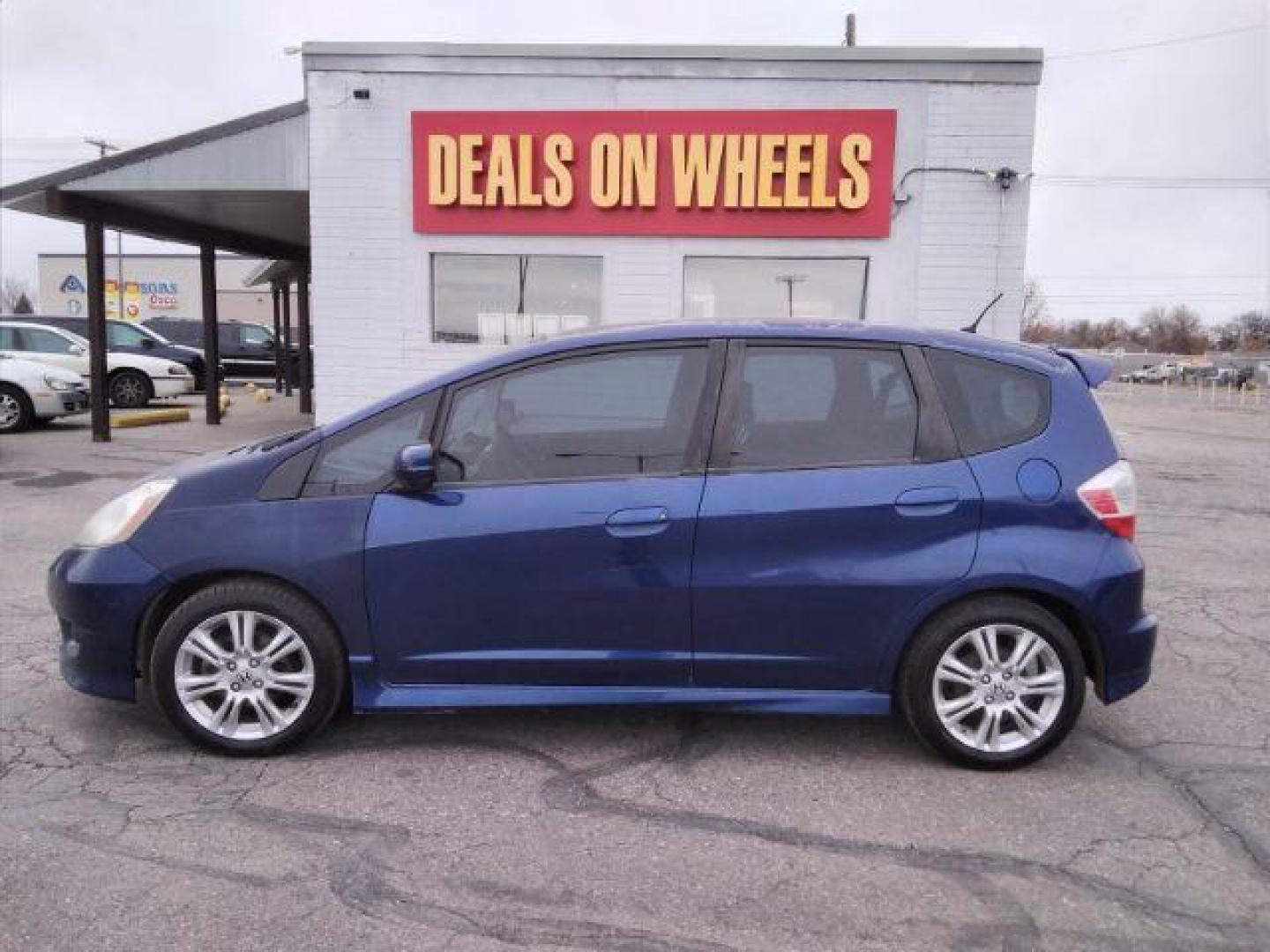 2009 Honda Fit Sport 5-Speed MT (JHMGE87409S) with an 1.5L L4 SOHC 16V engine, 5-Speed Manual transmission, located at 4047 Montana Ave., Billings, MT, 59101, 45.770847, -108.529800 - Photo#0