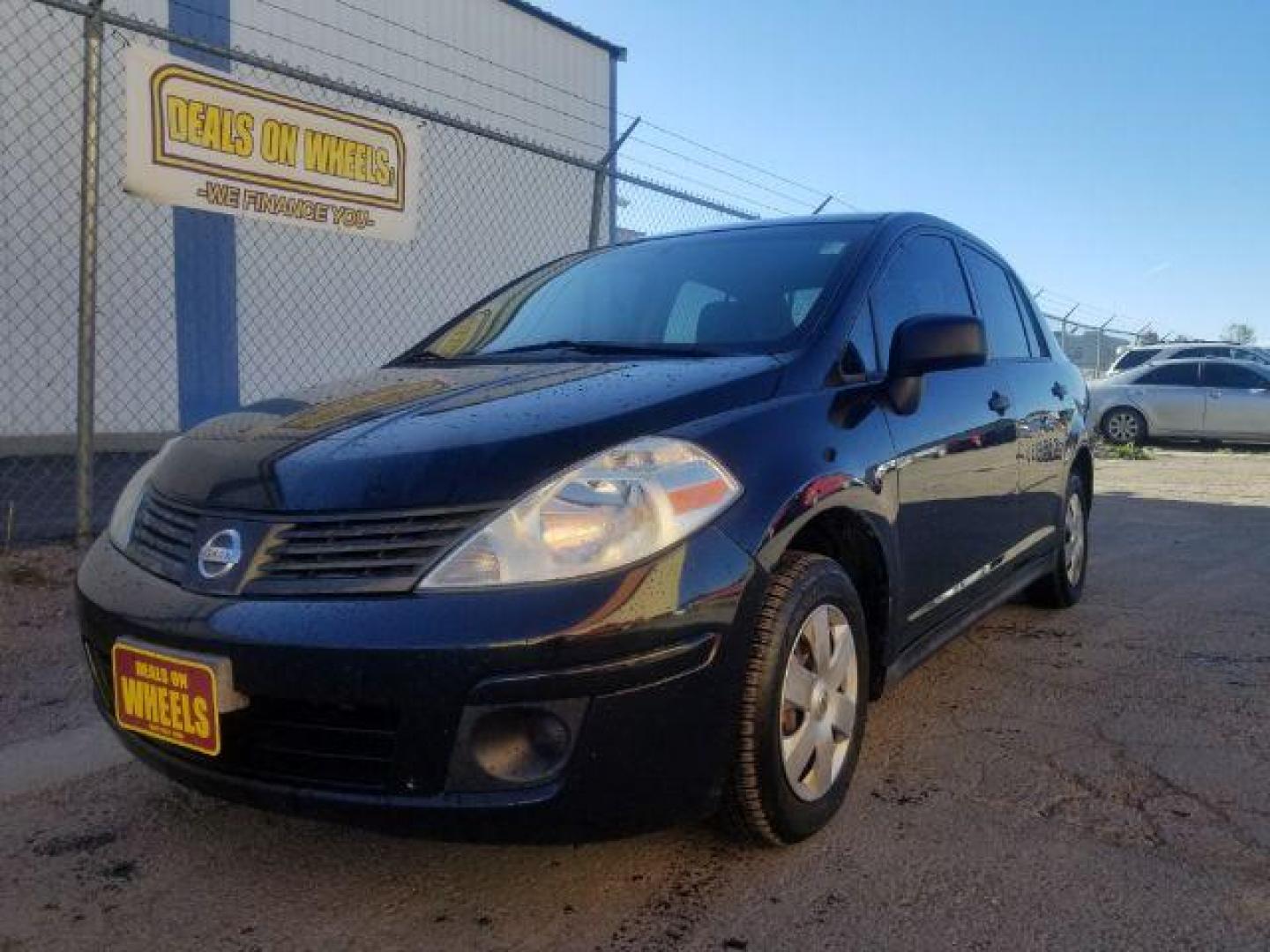 2009 Nissan Versa 1.6 Base Sedan (3N1CC11E79L) with an 1.6L L4 DOHC 16V engine, 5-Speed Manual transmission, located at 601 E. Idaho St., Kalispell, MT, 59901, 0.000000, 0.000000 - Photo#0