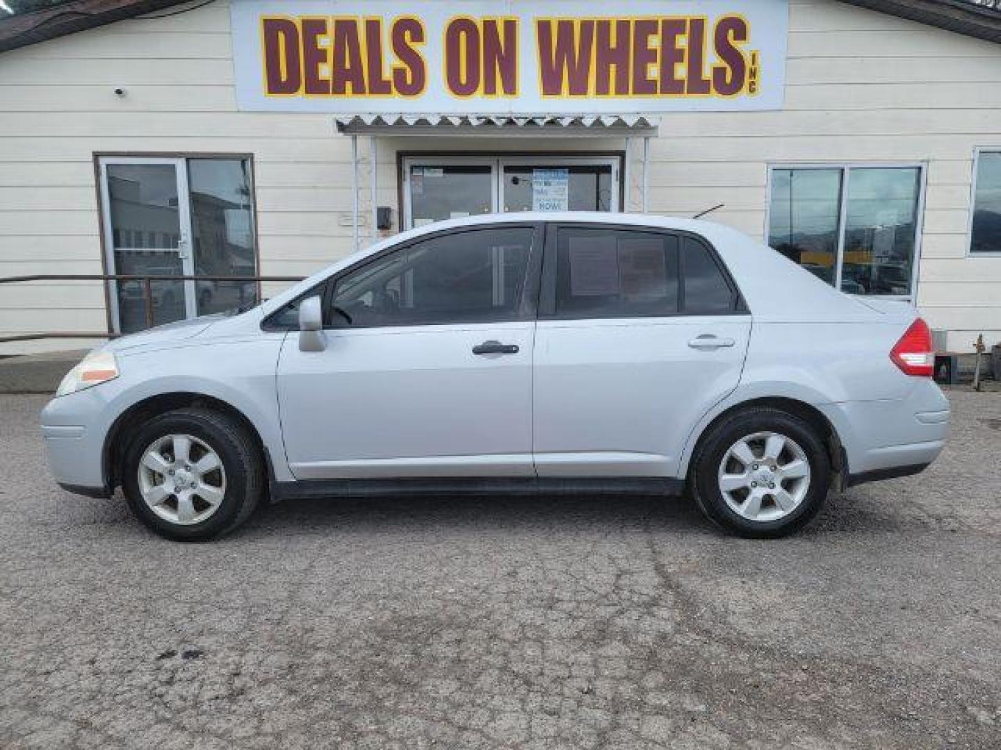 2009 Nissan Versa 1.8 S Sedan (3N1BC11E69L) with an 1.8L L4 DOHC 16V engine, located at 1800 West Broadway, Missoula, 59808, (406) 543-1986, 46.881348, -114.023628 - Photo#0