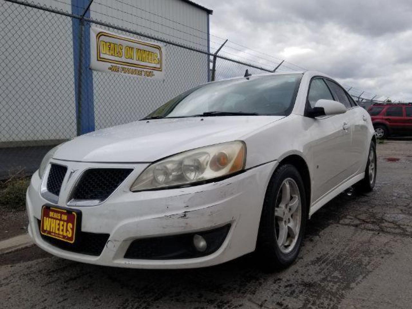 2009 Pontiac G6 Sedan (1G2ZJ57K694) with an 3.5L V6 OHV 12V engine, 4-Speed Automatic transmission, located at 601 E. Idaho St., Kalispell, MT, 59901, 0.000000, 0.000000 - Photo#0