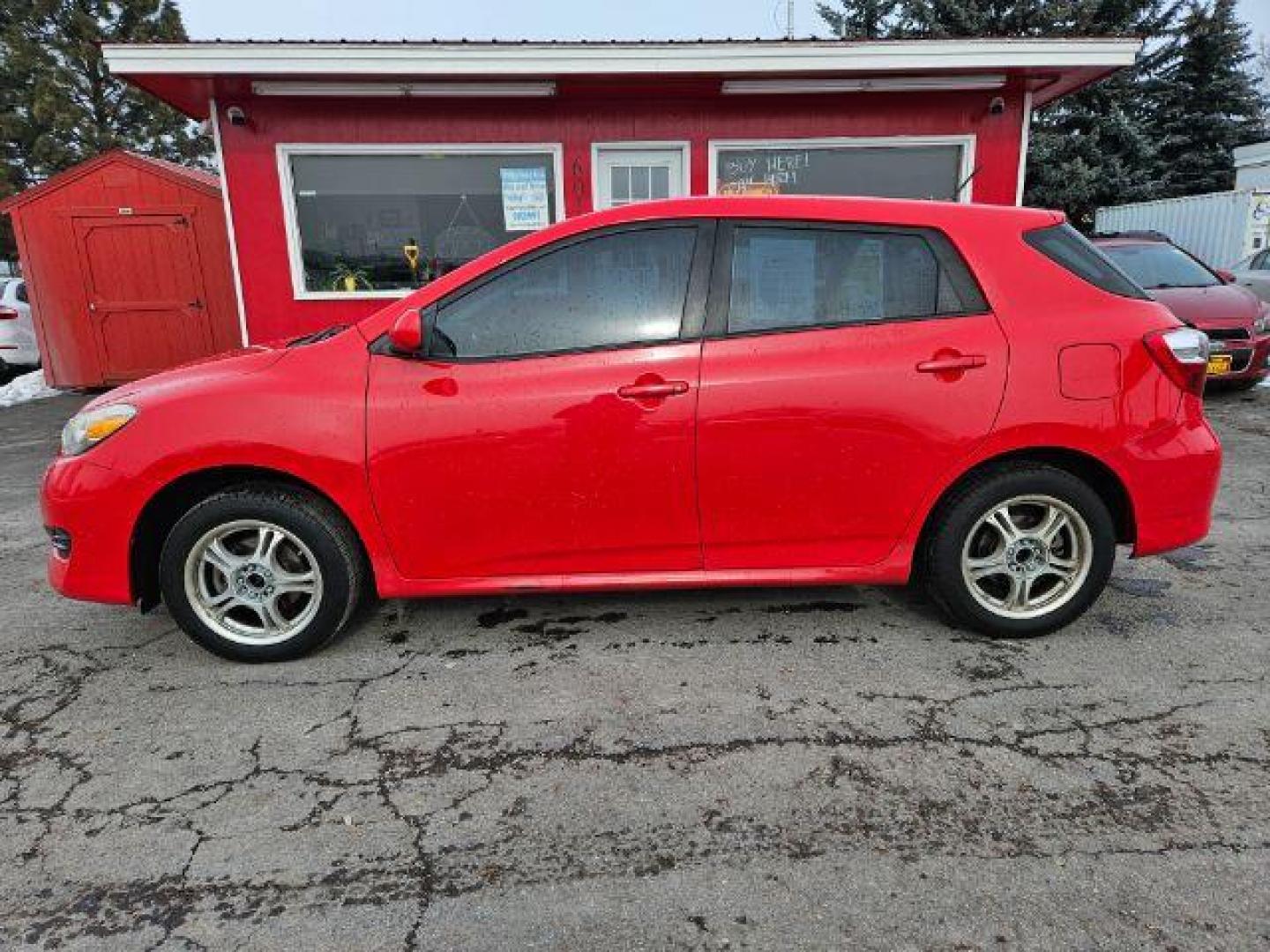 2009 Radiant Red Toyota Matrix Base 5-Speed MT (2T1KU40E09C) with an 1.8L L4 DOHC 16V engine, 5-Speed Manual transmission, located at 601 E. Idaho St., Kalispell, MT, 59901, 0.000000, 0.000000 - Photo#1