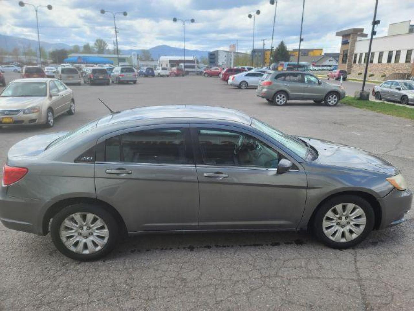 2012 Tungsten Metallic Chrysler 200 LX (1C3CCBAB1CN) with an 2.4L L4 DOHC 16V engine, 6-Speed Automatic transmission, located at 1800 West Broadway, Missoula, 59808, (406) 543-1986, 46.881348, -114.023628 - Photo#2