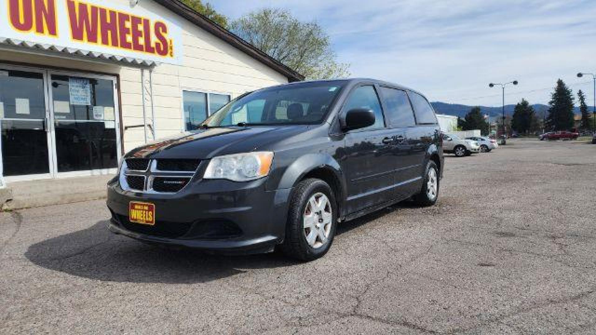 2012 Dark Charcoal Pearl Dodge Grand Caravan SE (2C4RDGBG9CR) with an 3.6L V6 DOHC 24V engine, 6-Speed Automatic transmission, located at 1800 West Broadway, Missoula, 59808, (406) 543-1986, 46.881348, -114.023628 - Photo#0