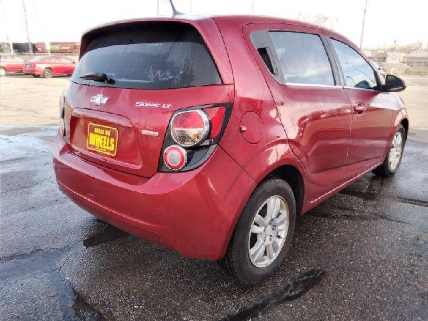 2013 Chevrolet Sonic LT Auto 5-Door (1G1JC6SB3D4) with an 1.4L L4 DOHC 24V TURBO engine, 6-Speed Automatic transmission, located at 4047 Montana Ave., Billings, MT, 59101, 45.770847, -108.529800 - Photo#4