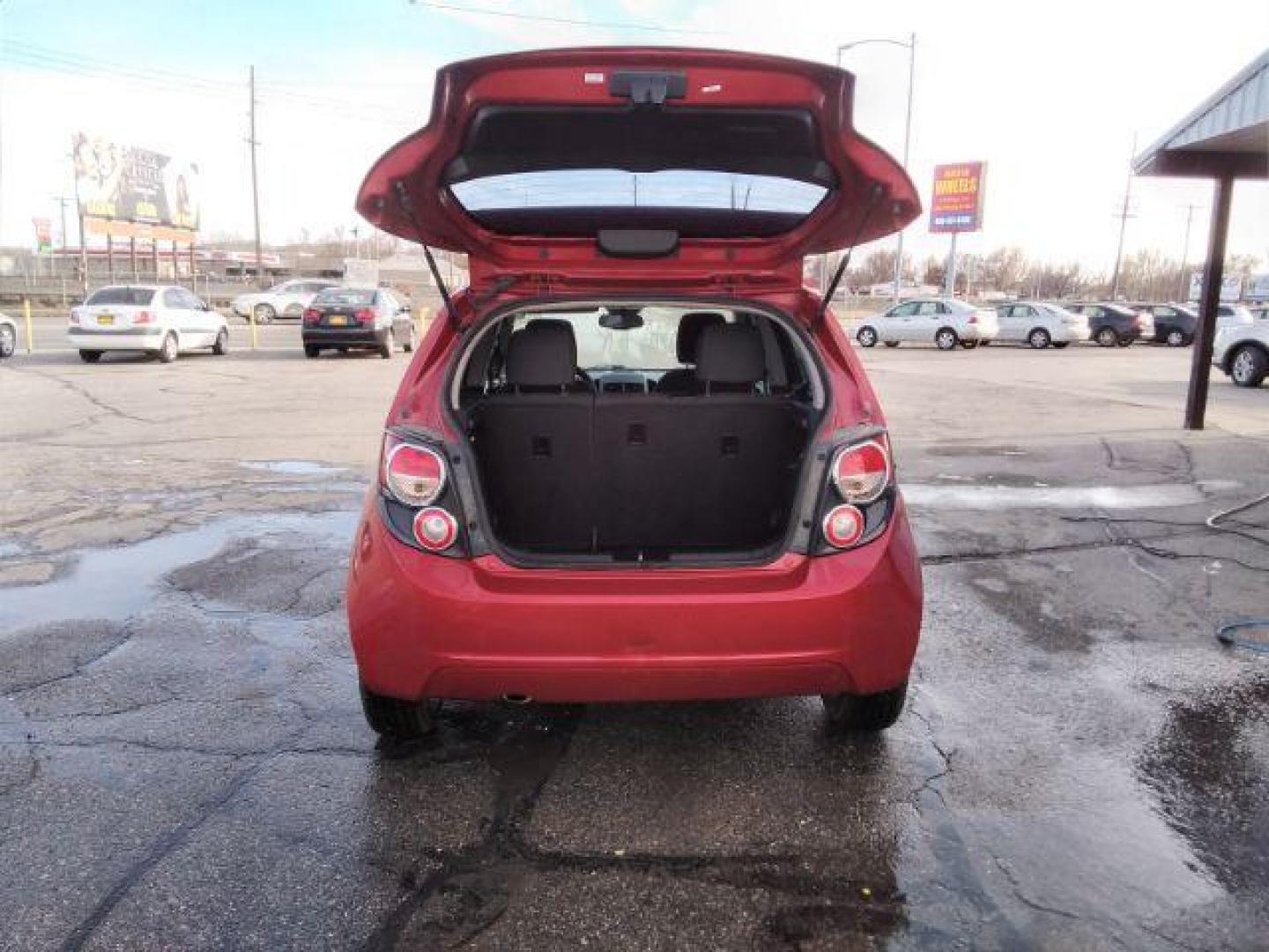 2013 Chevrolet Sonic LT Auto 5-Door (1G1JC6SB3D4) with an 1.4L L4 DOHC 24V TURBO engine, 6-Speed Automatic transmission, located at 4047 Montana Ave., Billings, MT, 59101, 45.770847, -108.529800 - Photo#5