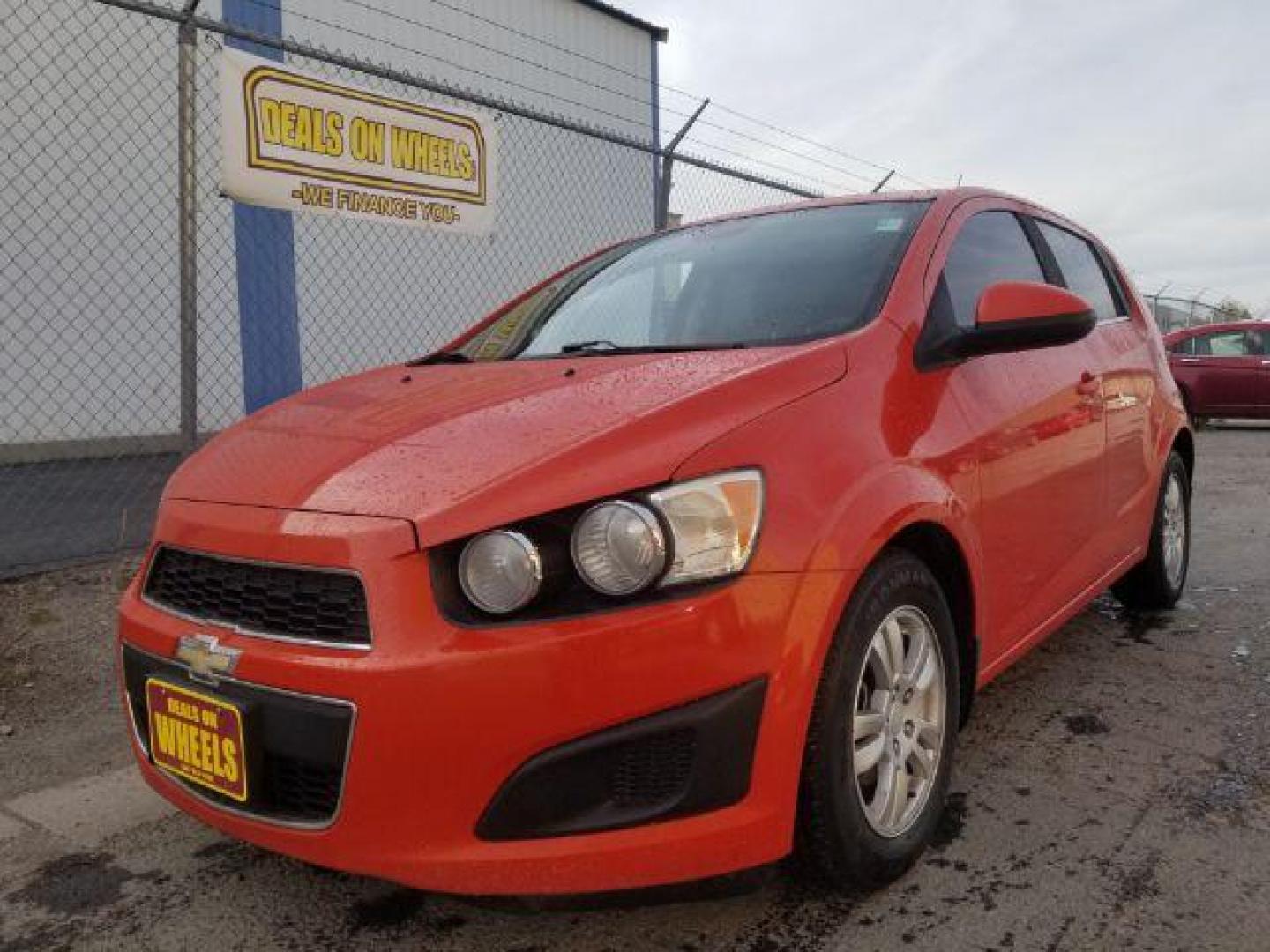 2013 Chevrolet Sonic LT Auto 5-Door (1G1JC6SG0D4) with an 1.8L L4 DOHC 24V engine, 6-Speed Automatic transmission, located at 4047 Montana Ave., Billings, MT, 59101, 45.770847, -108.529800 - Photo#0