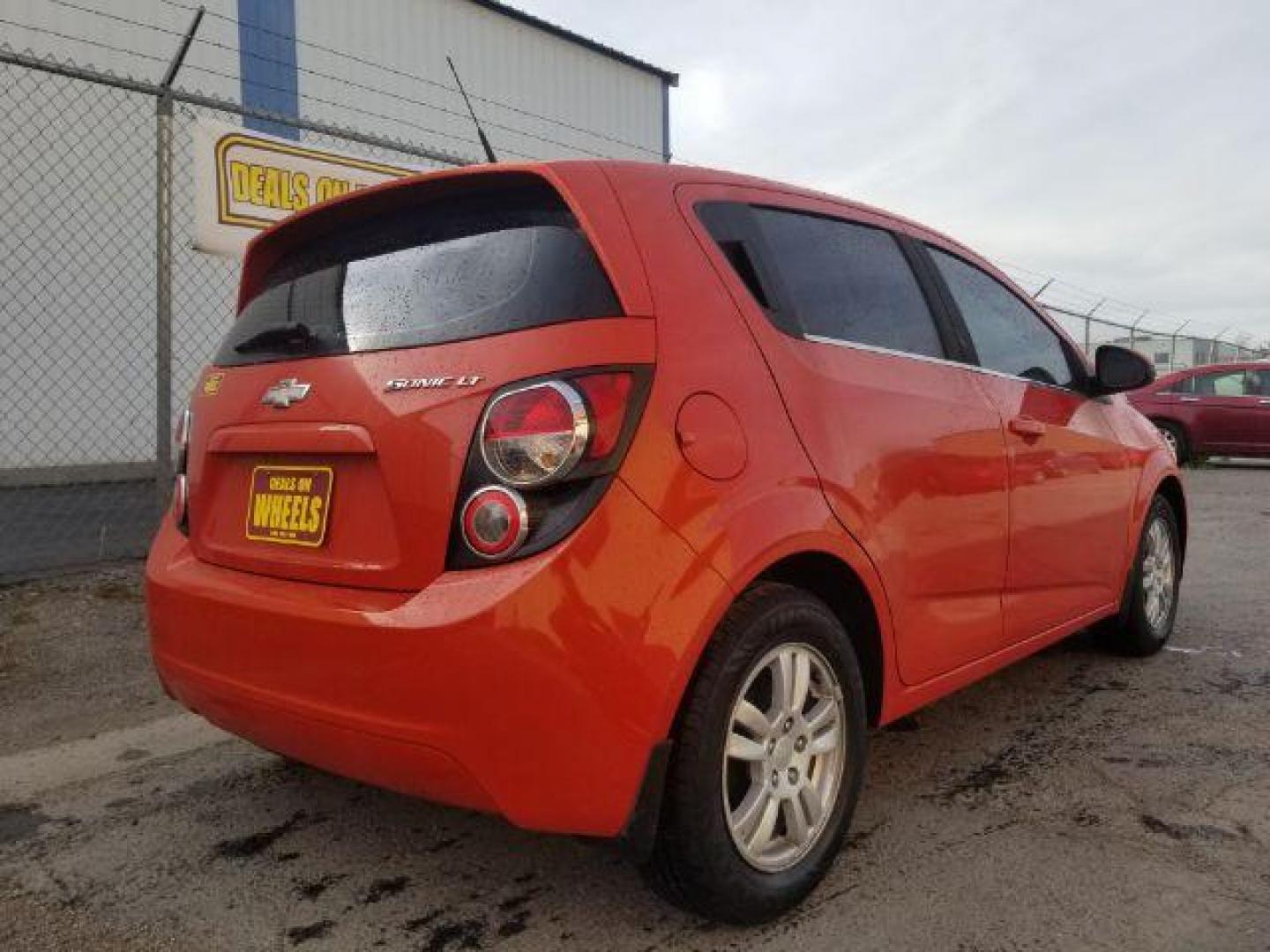 2013 Chevrolet Sonic LT Auto 5-Door (1G1JC6SG0D4) with an 1.8L L4 DOHC 24V engine, 6-Speed Automatic transmission, located at 4047 Montana Ave., Billings, MT, 59101, 45.770847, -108.529800 - Photo#4