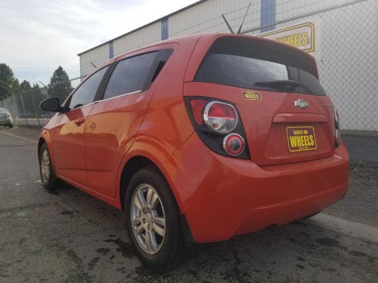 2013 Chevrolet Sonic LT Auto 5-Door (1G1JC6SG0D4) with an 1.8L L4 DOHC 24V engine, 6-Speed Automatic transmission, located at 4047 Montana Ave., Billings, MT, 59101, 45.770847, -108.529800 - Photo#5