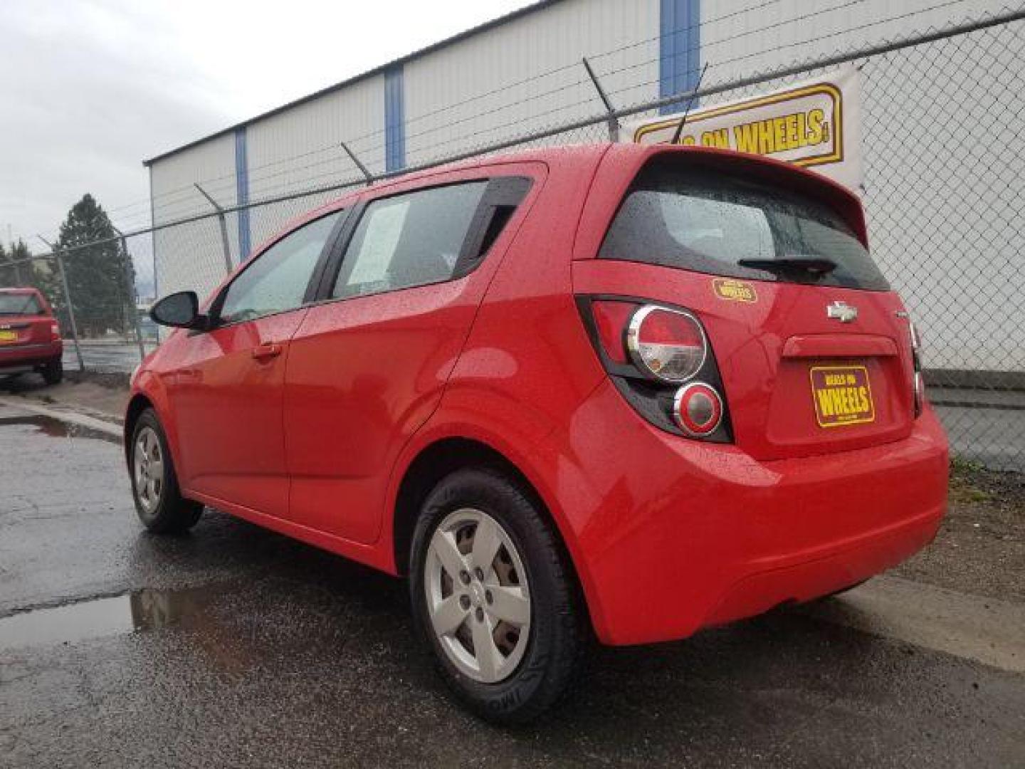 2013 Chevrolet Sonic LS Auto 5-Door (1G1JA6SH6D4) with an 1.8L L4 DOHC 24V engine, 6-Speed Automatic transmission, located at 4047 Montana Ave., Billings, MT, 59101, 45.770847, -108.529800 - Photo#5