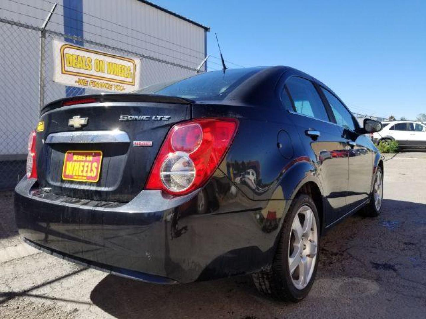 2013 Chevrolet Sonic LTZ Auto Sedan (1G1JE5SB4D4) with an 1.4L L4 DOHC 24V TUR engine, 6-Speed Automatic transmission, located at 601 E. Idaho St., Kalispell, MT, 59901, 0.000000, 0.000000 - Photo#4