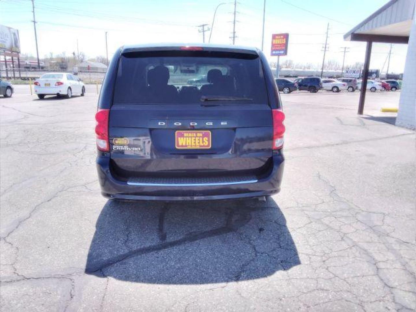 2013 Blue Streak Pearl Dodge Grand Caravan SE (2C4RDGBG5DR) with an 3.6L V6 DOHC 24V engine, 6-Speed Automatic transmission, located at 4047 Montana Ave., Billings, MT, 59101, 45.770847, -108.529800 - Photo#3