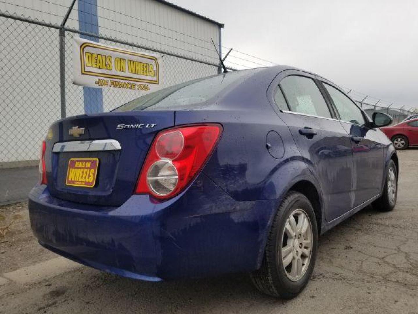 2014 Chevrolet Sonic LT Auto Sedan (1G1JC5SH7E4) with an 1.8L L4 DOHC 24V engine, 6-Speed Automatic transmission, located at 601 E. Idaho St., Kalispell, MT, 59901, 0.000000, 0.000000 - Photo#4