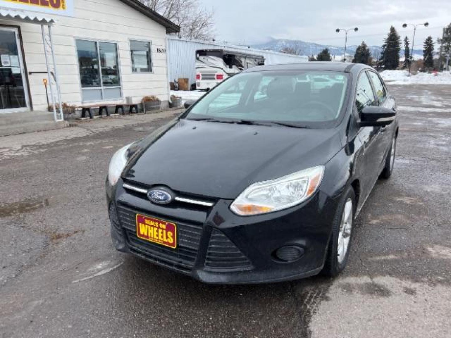 2014 Tuxedo Black Metalli Ford Focus SE Sedan (1FADP3F20EL) with an 2.0L L4 DOHC 16V engine, located at 1800 West Broadway, Missoula, 59808, (406) 543-1986, 46.881348, -114.023628 - Photo#0