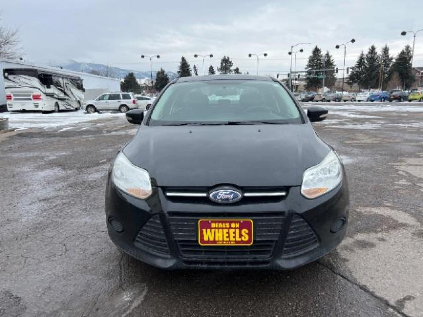 2014 Tuxedo Black Metalli Ford Focus SE Sedan (1FADP3F20EL) with an 2.0L L4 DOHC 16V engine, located at 1800 West Broadway, Missoula, 59808, (406) 543-1986, 46.881348, -114.023628 - Photo#1