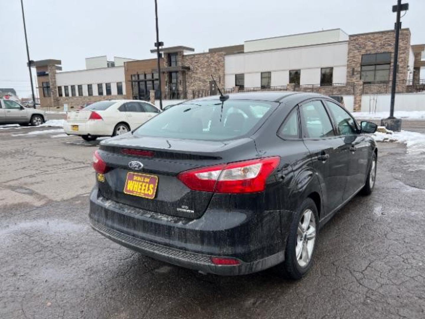 2014 Tuxedo Black Metalli Ford Focus SE Sedan (1FADP3F20EL) with an 2.0L L4 DOHC 16V engine, located at 1800 West Broadway, Missoula, 59808, (406) 543-1986, 46.881348, -114.023628 - Photo#3