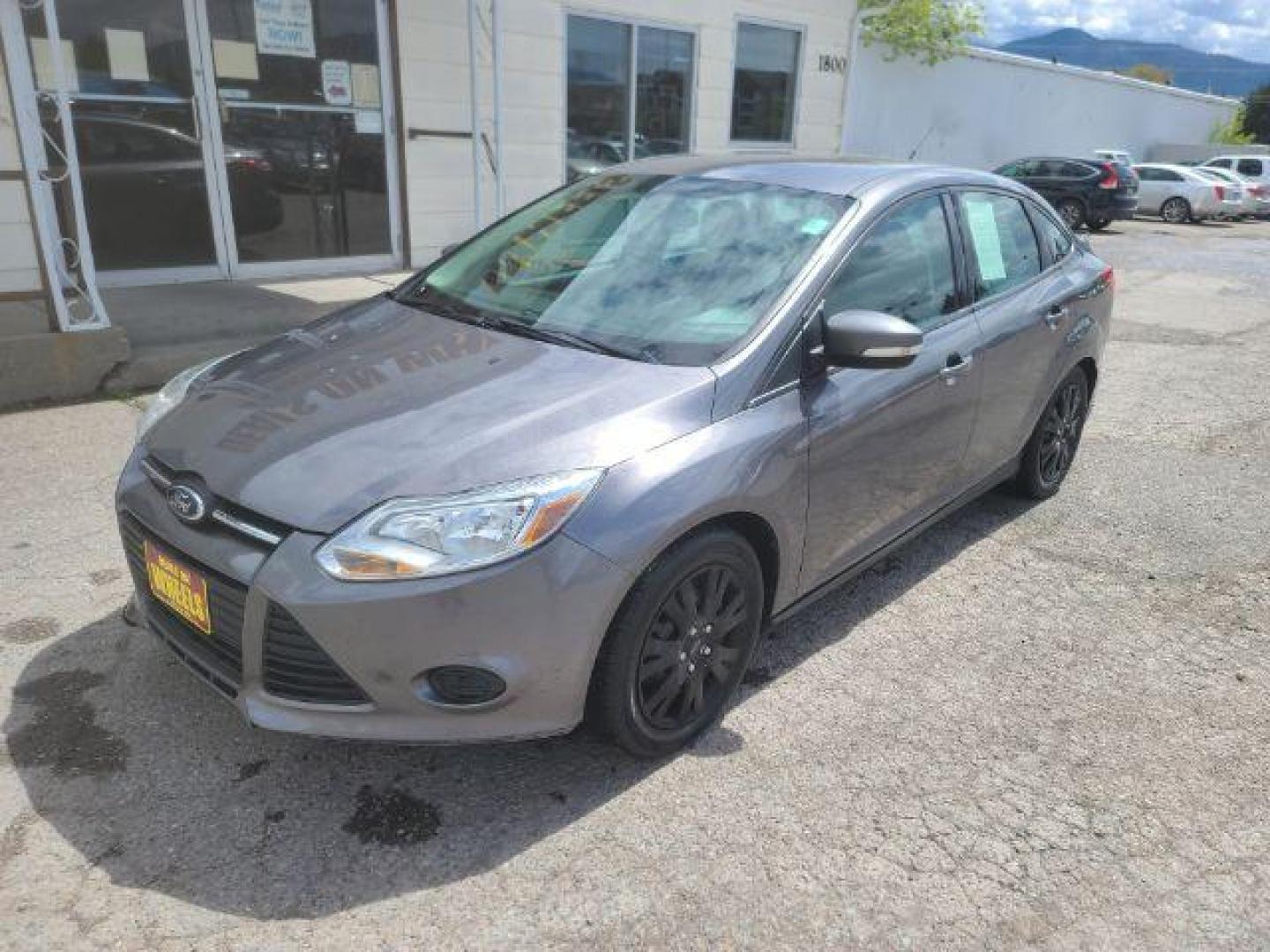 2014 Sterling Gray Metall Ford Focus SE Sedan (1FADP3F23EL) with an 2.0L L4 DOHC 16V engine, located at 1800 West Broadway, Missoula, 59808, (406) 543-1986, 46.881348, -114.023628 - Photo#0